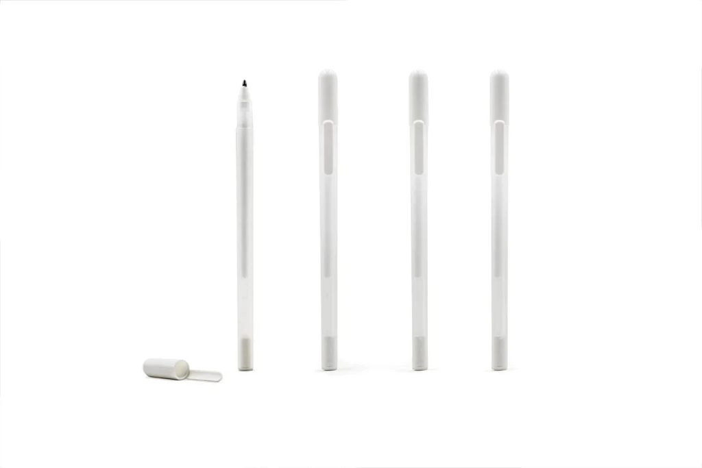 Brow Mapping Pen: four white pens shown standing in a row, one with its cap off