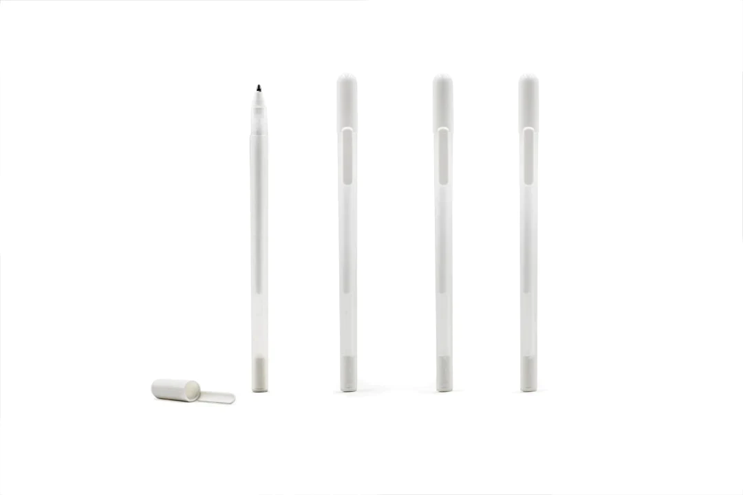 Brow Mapping Pen: four white pens shown standing in a row, one with its cap off