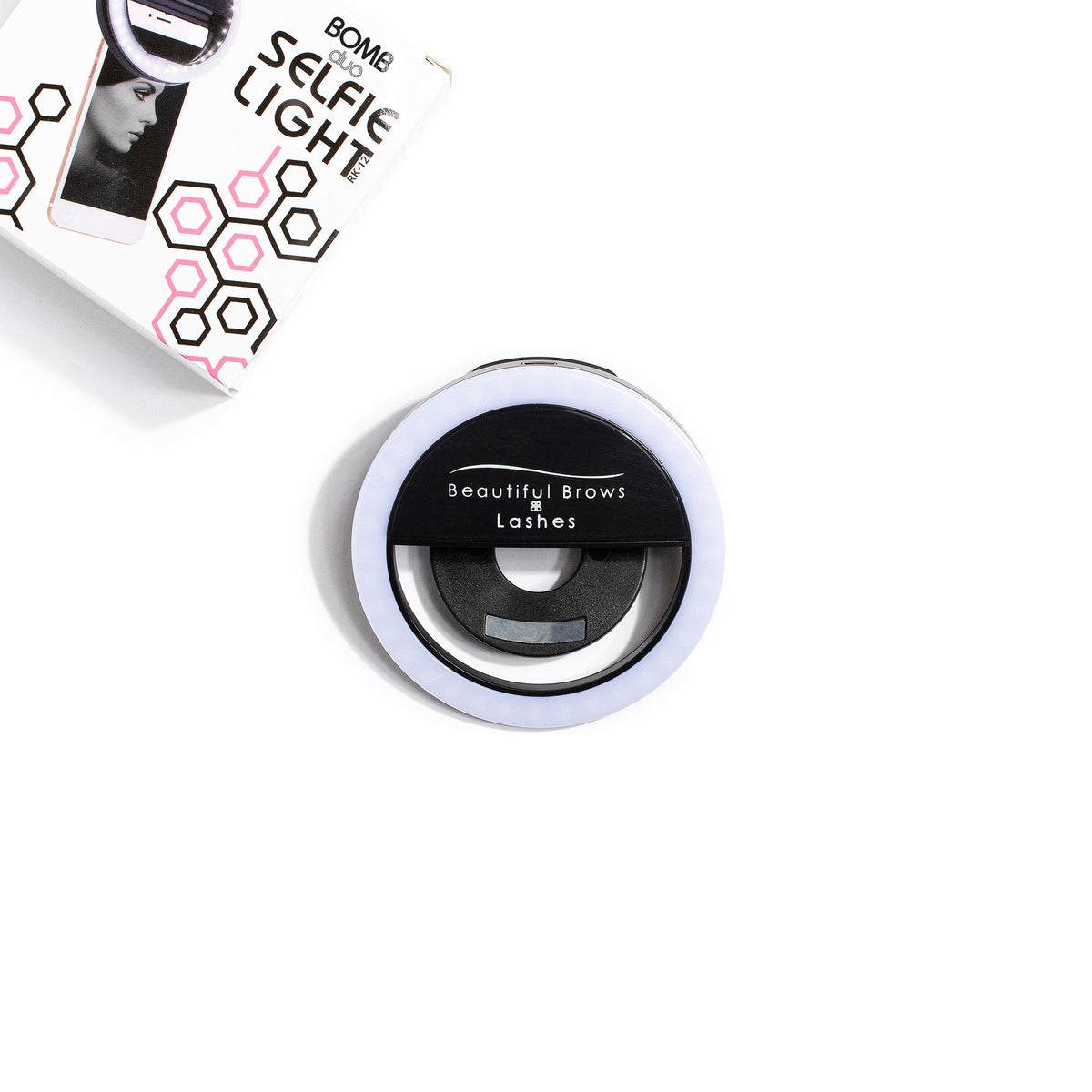 Selfie Ring Light, a round clip-on light with the Beautiful Brows and Lashes logo, next to its box